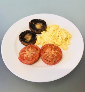 Mini cooked breakfast: scrambled eggs and grilled mushrooms and tomatoes provide a tasty, healthy, quick and easy protein meal